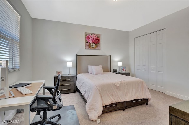 carpeted bedroom featuring a closet