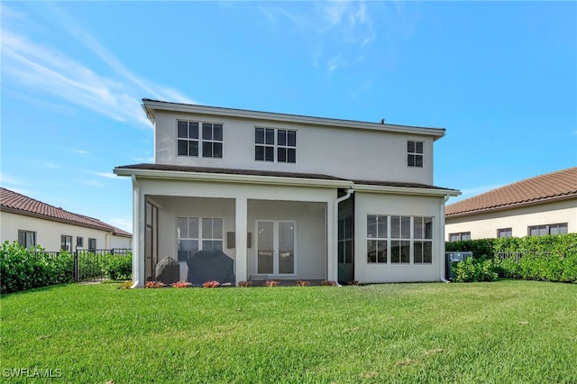 rear view of house with a yard and central AC unit