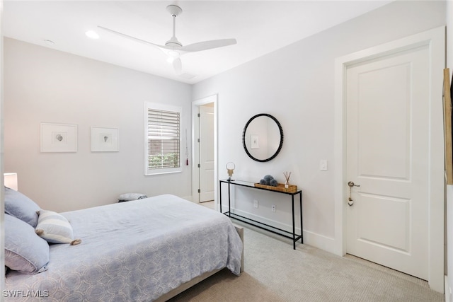 carpeted bedroom with ceiling fan