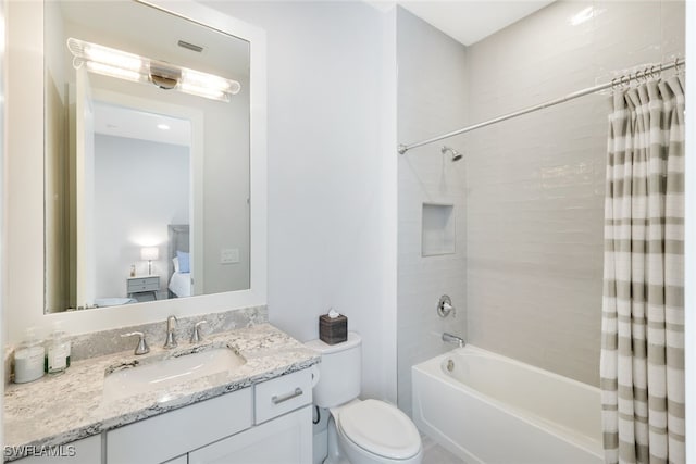 full bathroom with vanity, toilet, and shower / bath combo