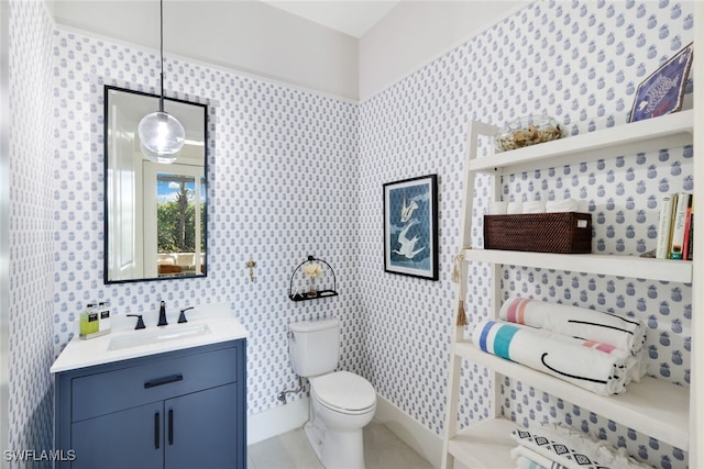 bathroom with vanity and toilet