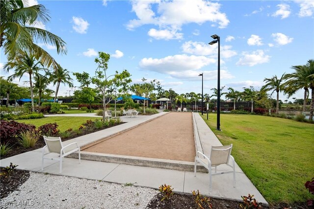 view of property's community with a lawn