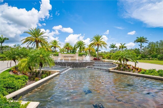 view of pool with a water view