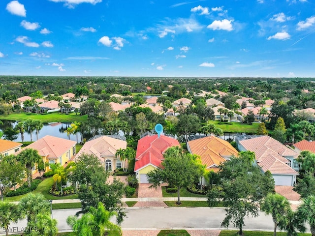 drone / aerial view with a water view