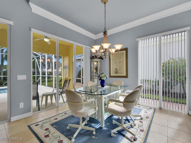 tiled dining space featuring crown molding and ceiling fan with notable chandelier