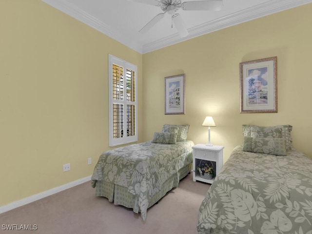 bedroom with ceiling fan, ornamental molding, and carpet floors