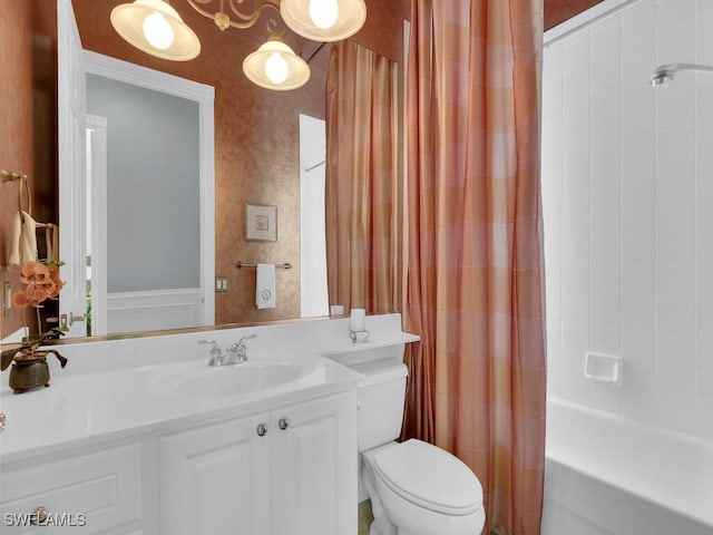 full bathroom featuring vanity, toilet, and shower / tub combo with curtain