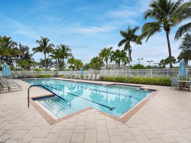 view of swimming pool with a patio area