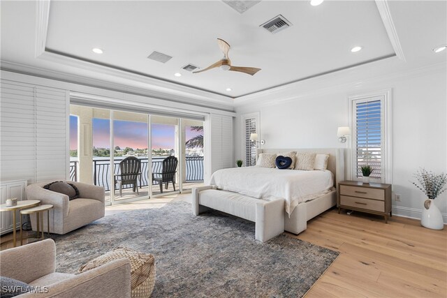 bedroom with access to outside, multiple windows, ceiling fan, and light hardwood / wood-style flooring