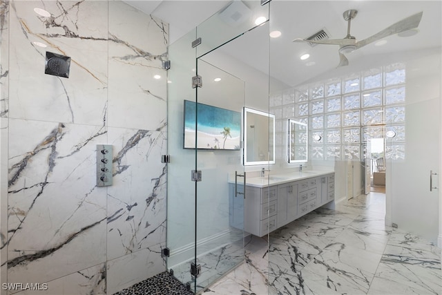 bathroom with ceiling fan, a shower with door, and vanity