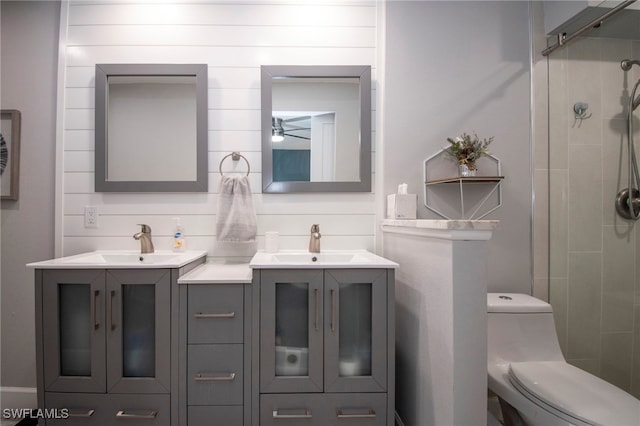 bathroom featuring vanity, an enclosed shower, and toilet