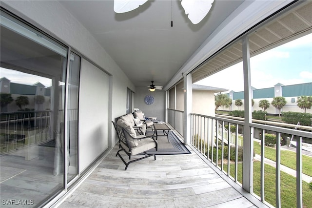 balcony featuring ceiling fan