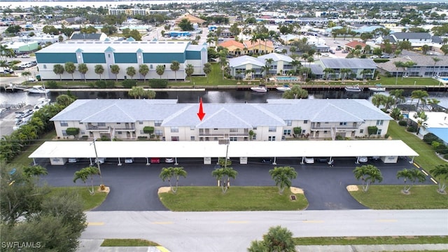 birds eye view of property with a water view