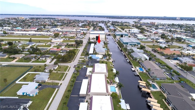 birds eye view of property featuring a water view