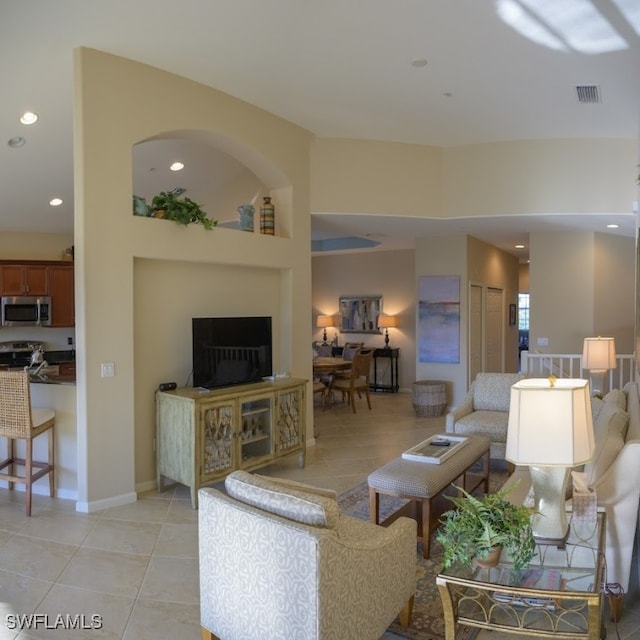 living room with light tile patterned floors