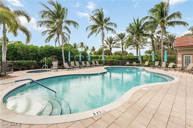 view of swimming pool featuring a patio