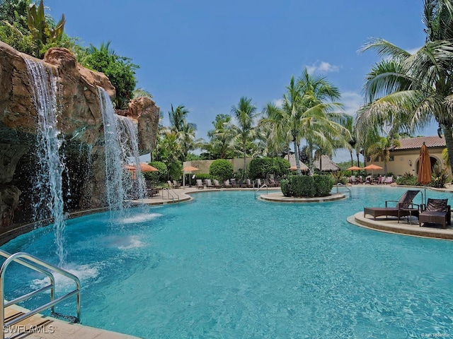 view of pool with pool water feature