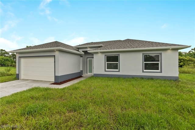 view of front of home with a garage and a front lawn