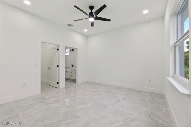 unfurnished room with ceiling fan