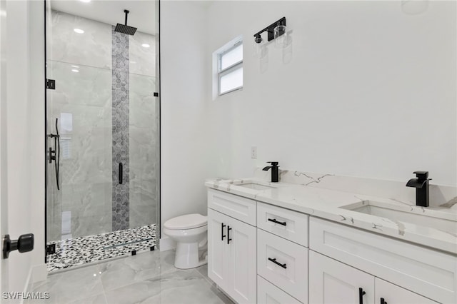 bathroom with vanity, toilet, and walk in shower