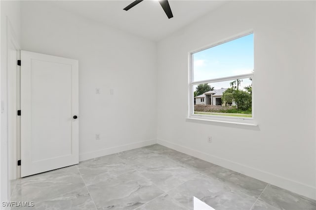 unfurnished room featuring ceiling fan