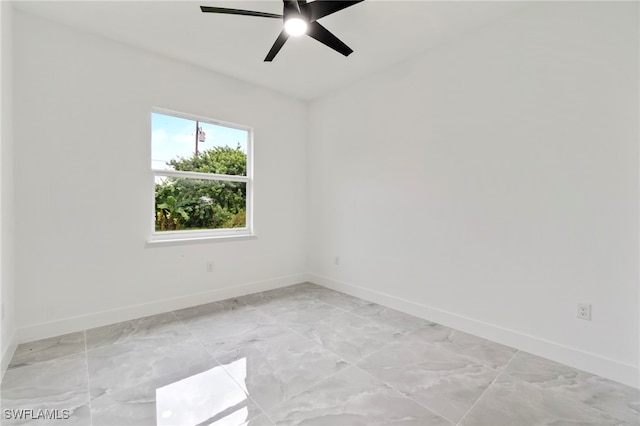 spare room with ceiling fan