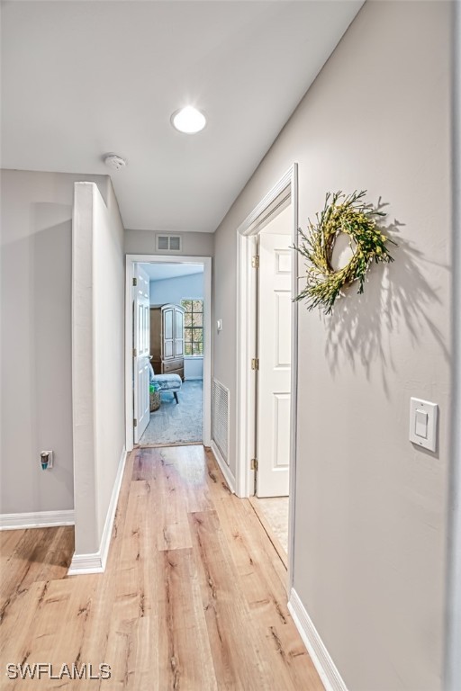 hall with light wood-type flooring