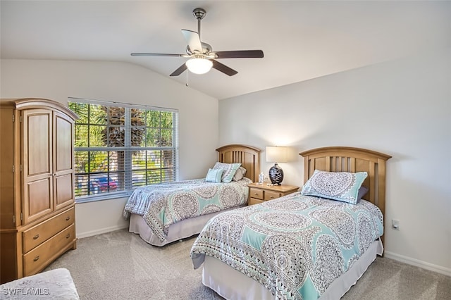 carpeted bedroom with ceiling fan and lofted ceiling