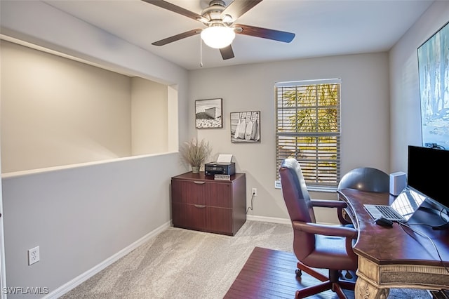 carpeted office with ceiling fan