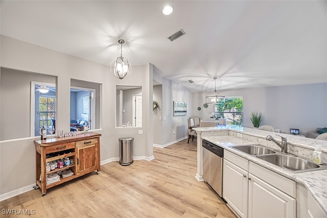 kitchen featuring dishwasher, white cabinets, pendant lighting, and light hardwood / wood-style floors