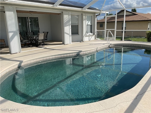 view of swimming pool featuring a patio area