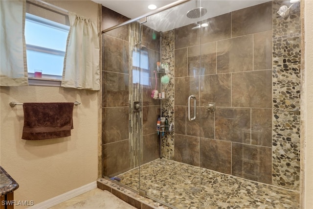 bathroom featuring an enclosed shower