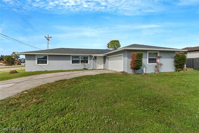 ranch-style house with a garage and a front lawn