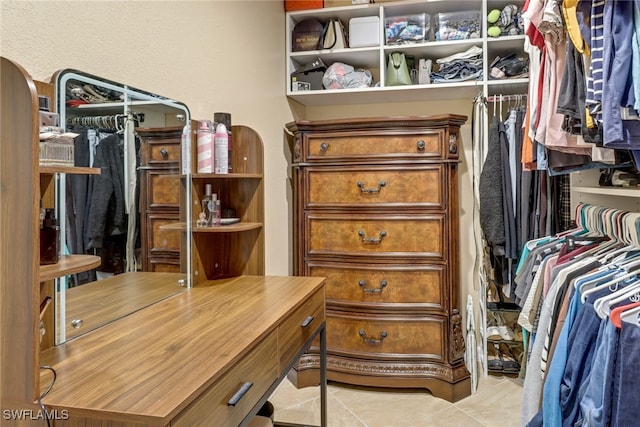 spacious closet with light tile patterned flooring