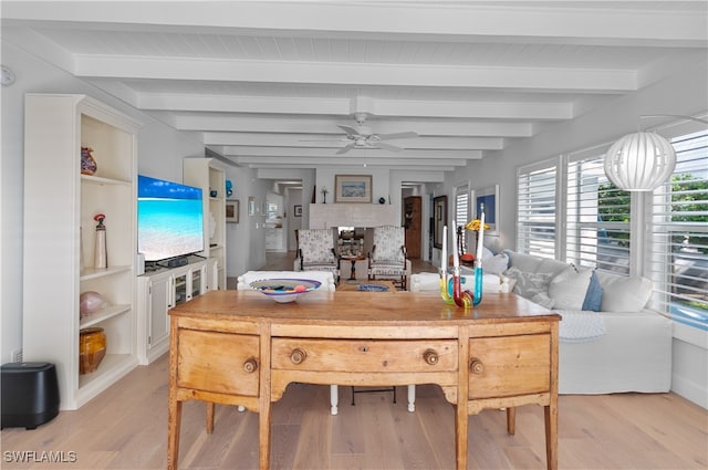 dining area with beam ceiling, ceiling fan, and light wood-type flooring