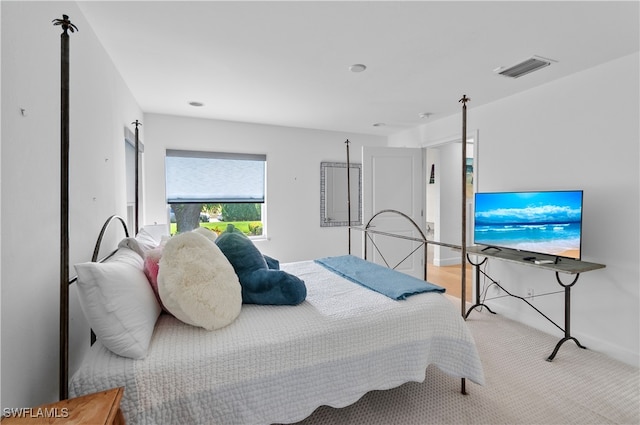 bedroom featuring light colored carpet