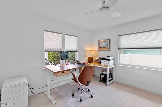 office area with light colored carpet and ceiling fan