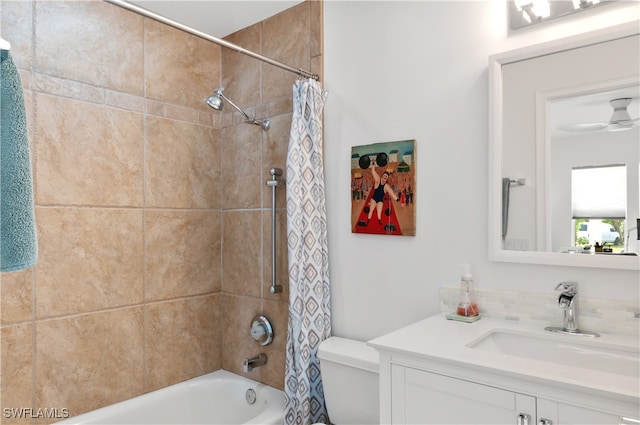 full bathroom with shower / bath combination with curtain, vanity, toilet, and ceiling fan