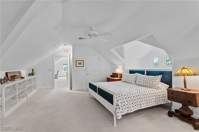 carpeted bedroom with ceiling fan and lofted ceiling