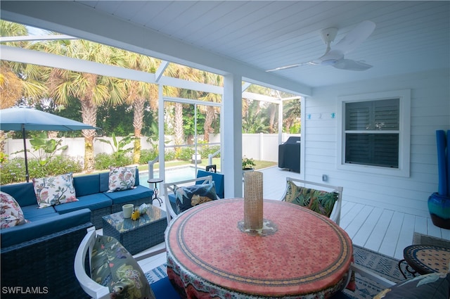 sunroom / solarium with ceiling fan