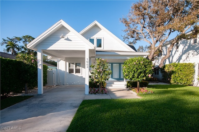 view of front of property featuring a carport and a front lawn