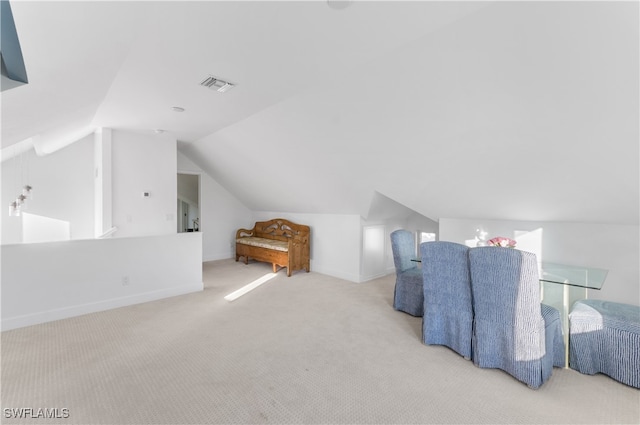 bonus room featuring light colored carpet and lofted ceiling