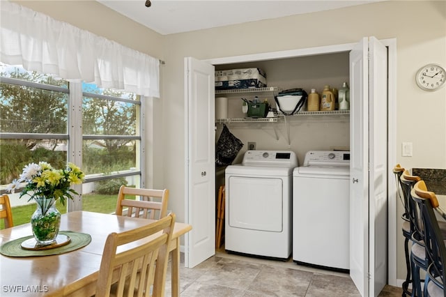 clothes washing area with independent washer and dryer