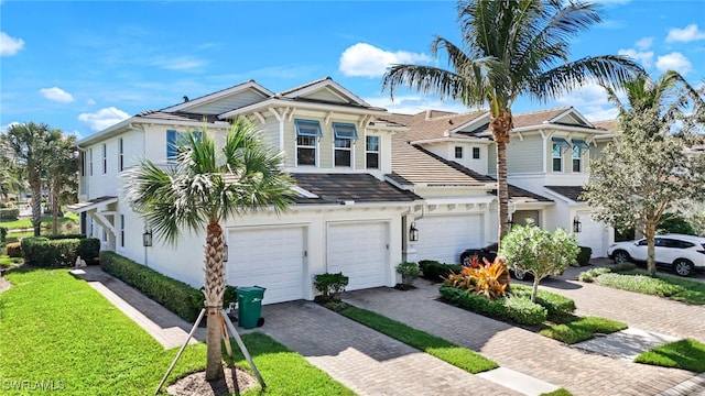 townhome / multi-family property featuring a garage