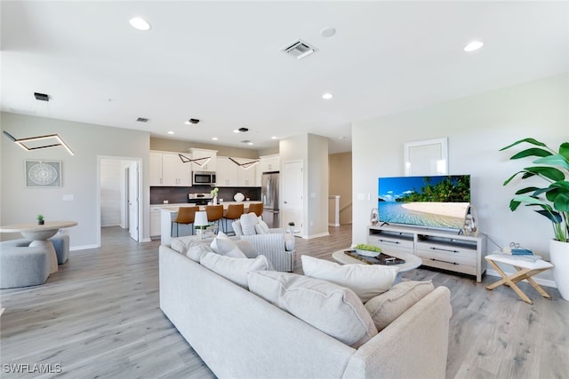 living room featuring light hardwood / wood-style flooring