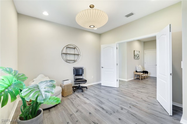 home office with light wood-type flooring