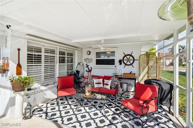 sunroom / solarium featuring ceiling fan