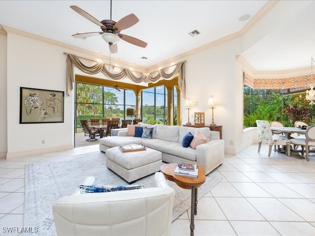 living room with ceiling fan, light tile patterned floors, and ornamental molding