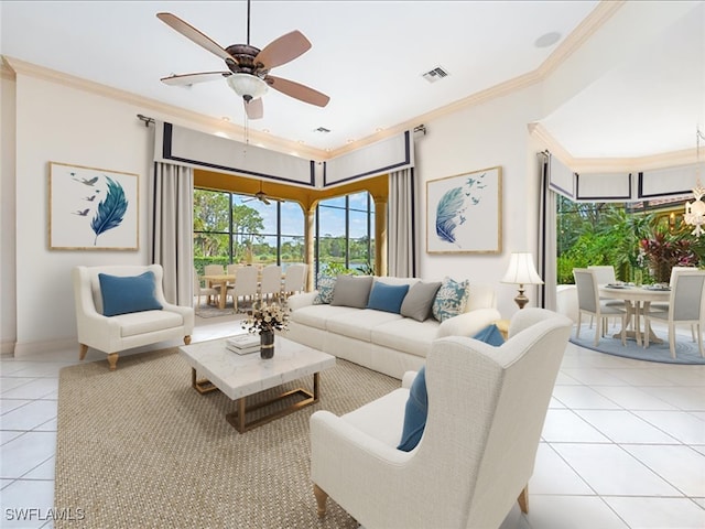 living room with ceiling fan, light tile patterned flooring, and ornamental molding