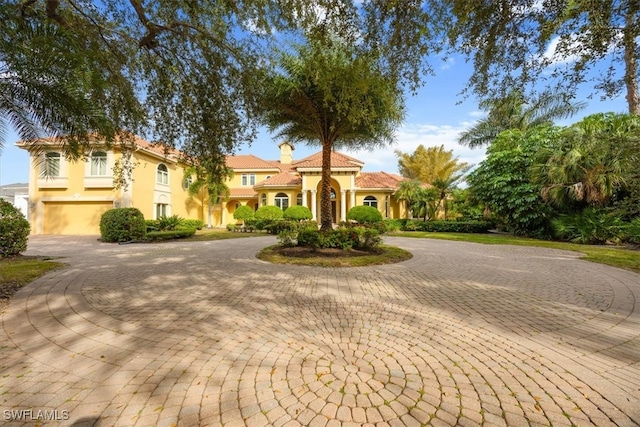 mediterranean / spanish-style house featuring a garage